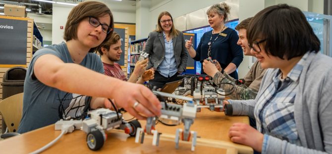Students from Centre High Campus experiment with EPL's Makerspace technology while EPL Associate Manager Holly and CHC teacher-librarian Karen look on.