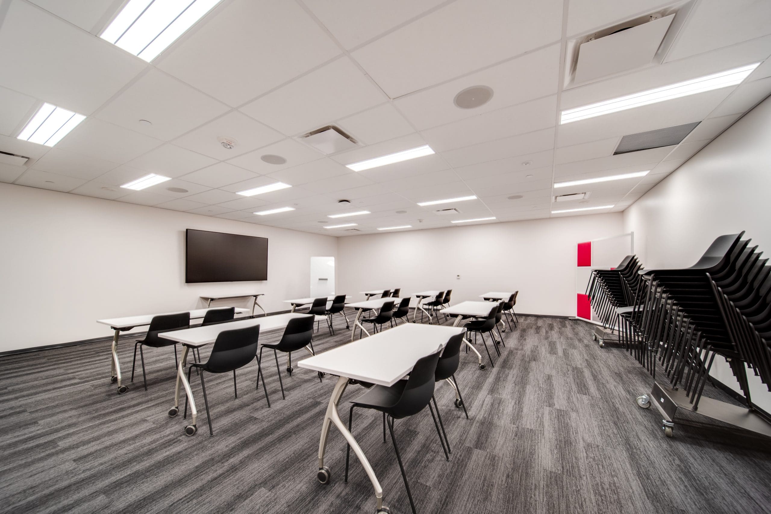 Chairs and tables arranged in TD Explore room in Stanley A Milner library